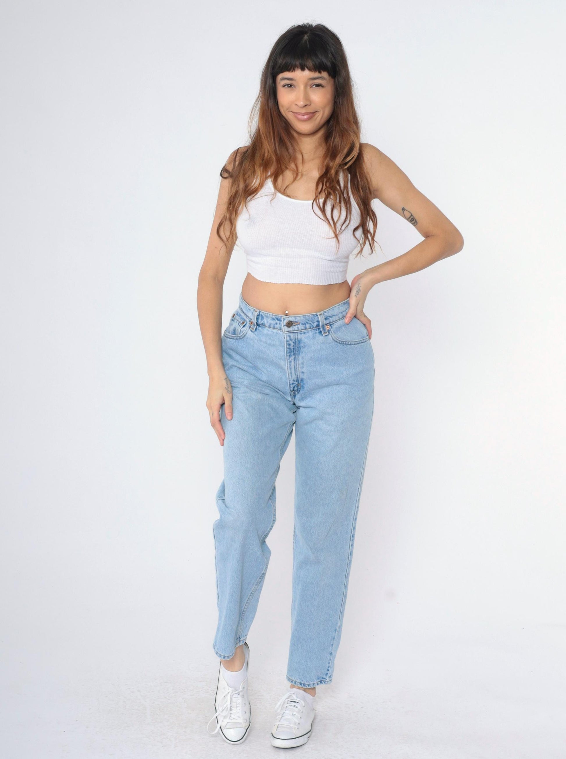 90s Levi's 550 High Waist Relaxed Tapered Jeans Light Wash Medium