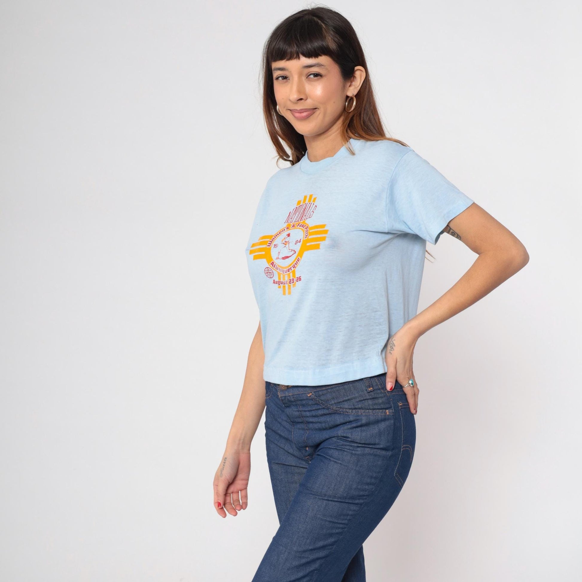 80s Albuquerque Women's A Fast Pitch Softball Graphic Tee Baby Blue Cropped Medium