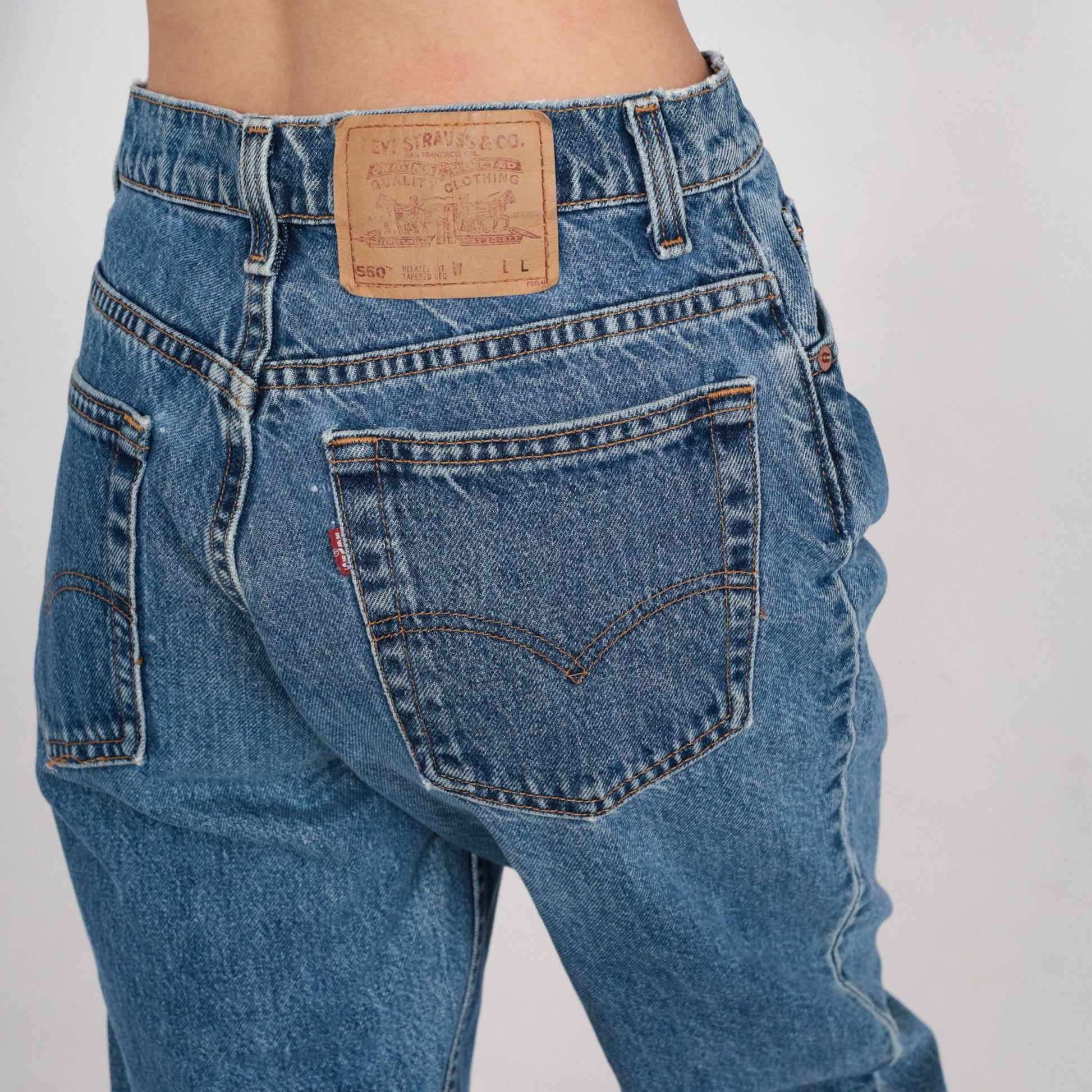 90s Levi's 550 High Waisted Tapered Jeans Blue Denim Long 11