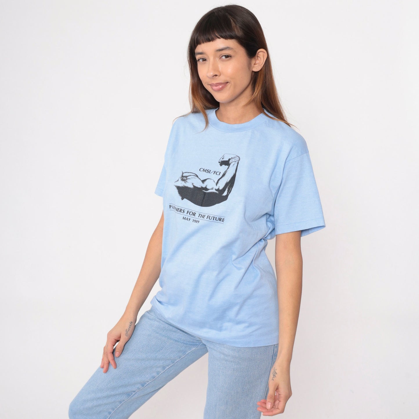 80s Muscular Arm Graphic T-Shirt CMSI FCI Partners Baby Blue Medium