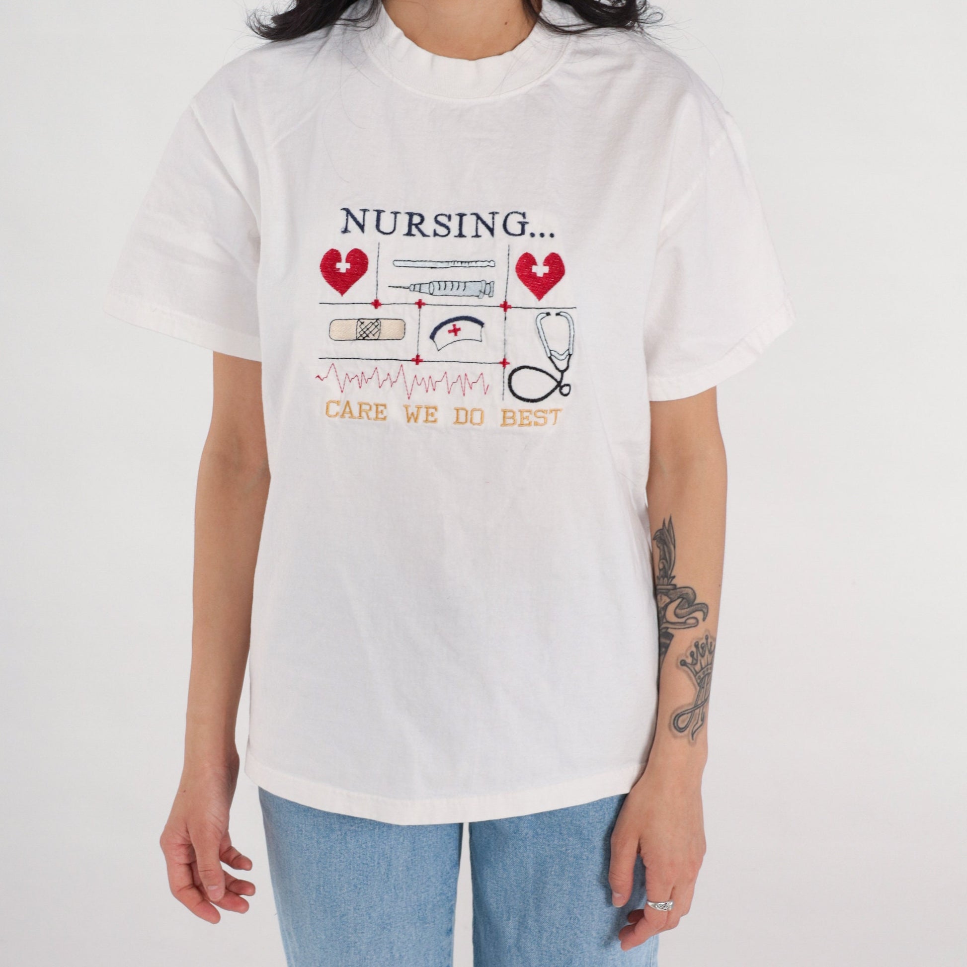 90s Nurse Graphic T-Shirt "Care We Do Best" Embroidered White Cotton Medium M