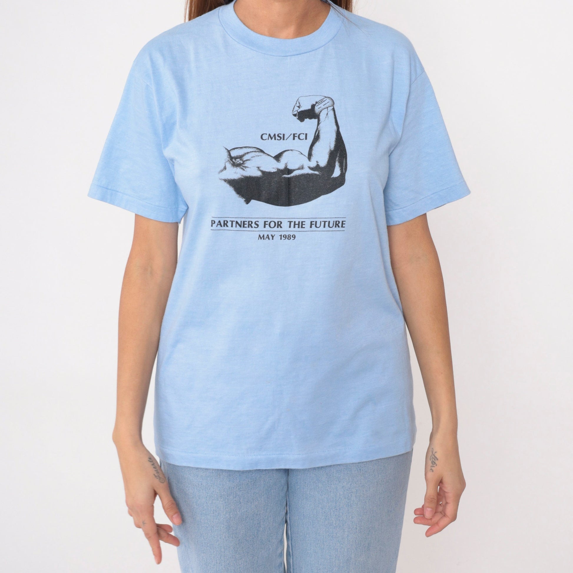 80s Muscular Arm Graphic T-Shirt CMSI FCI Partners Baby Blue Medium