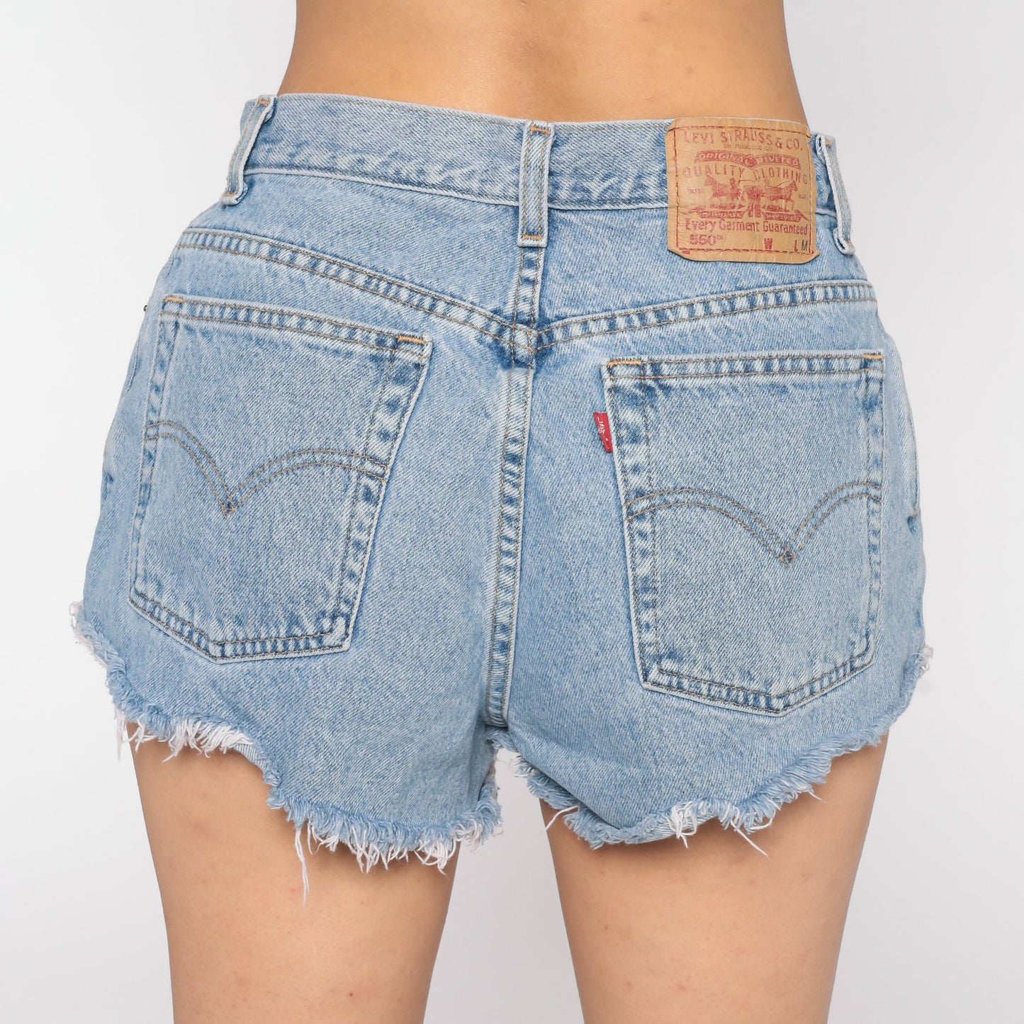 80s Levi's 550 High-Waisted Denim Cutoff Shorts Blue Ripped Frayed 30