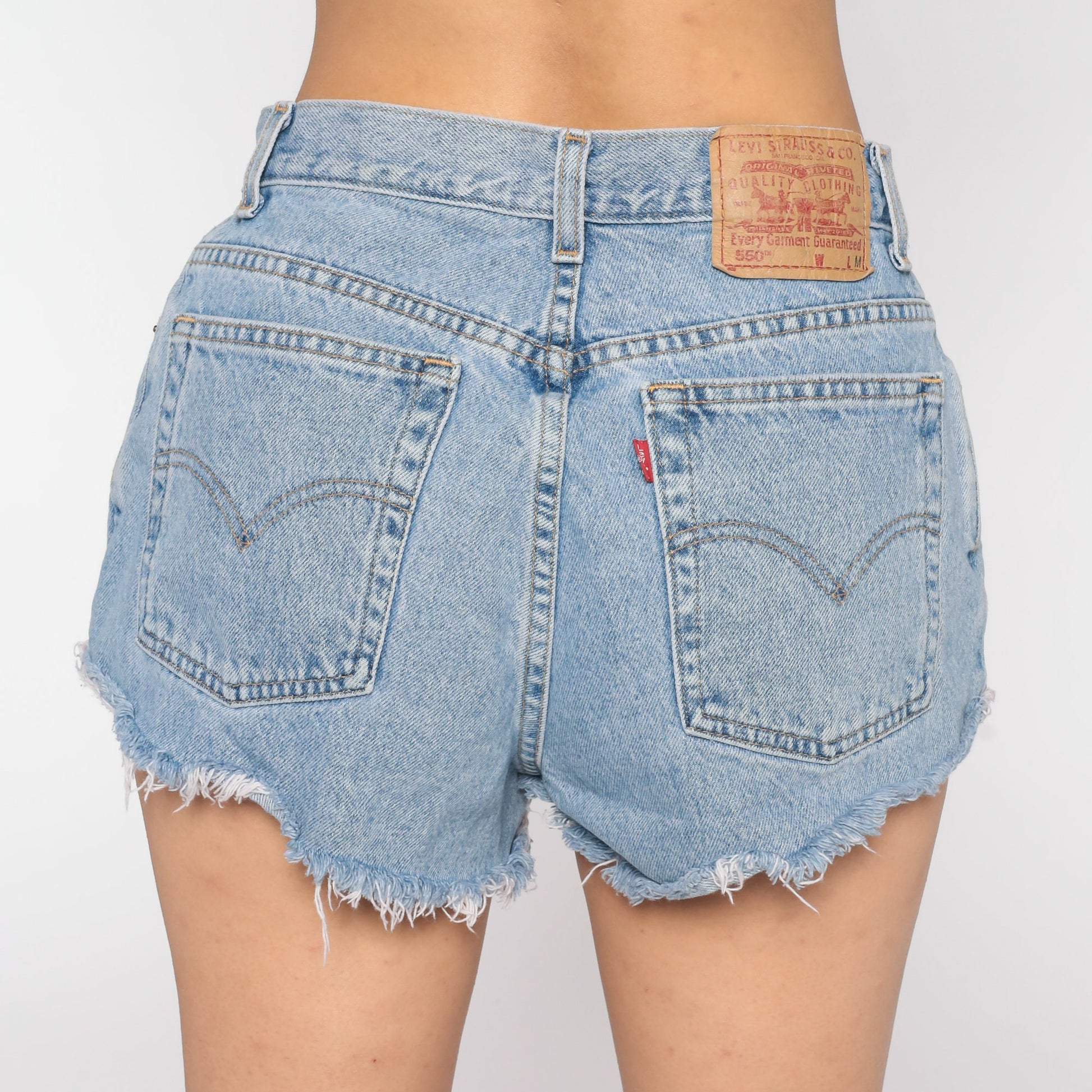 80s Levi's 550 High-Waisted Denim Cutoff Shorts Blue Ripped Frayed 30