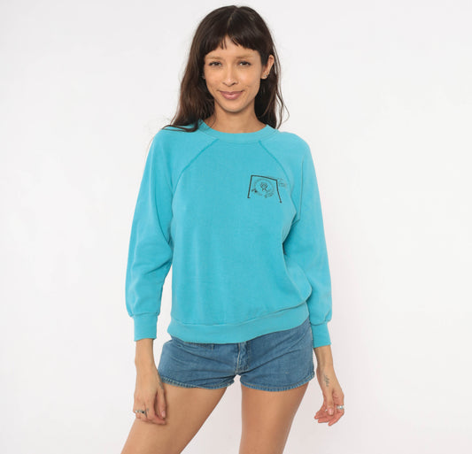 90s University New Mexico Cancer Center Teal Raglan Sleeve Pullover Sweatshirt Sky Blue Cotton Collegiate Academic Graphic Vintage Small S